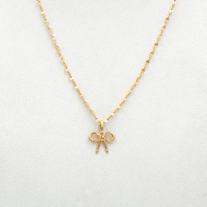 Conjunto Lazo de oro 18k con cadena y colgante delicado, joya femenina y elegante.